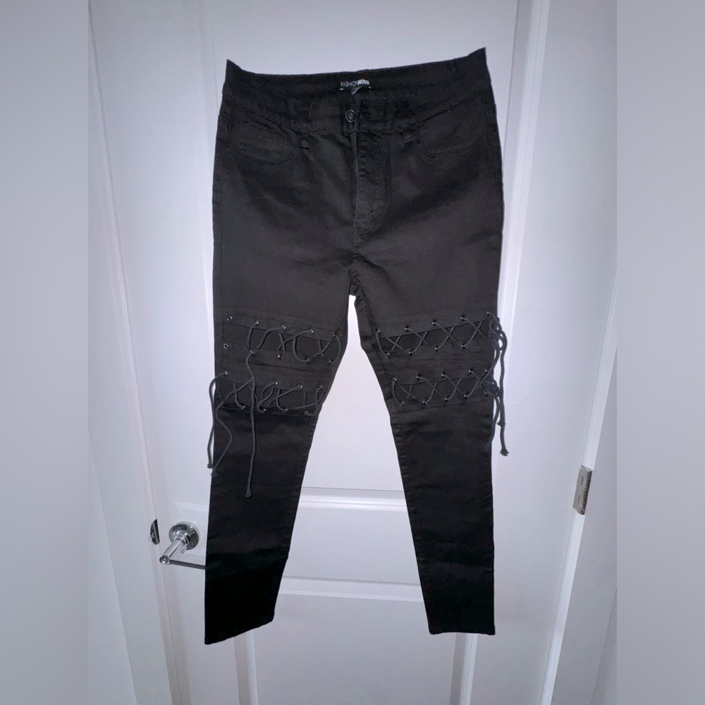 Fashion Nova, black denim, with lace up detail on thigh area. Size 11.